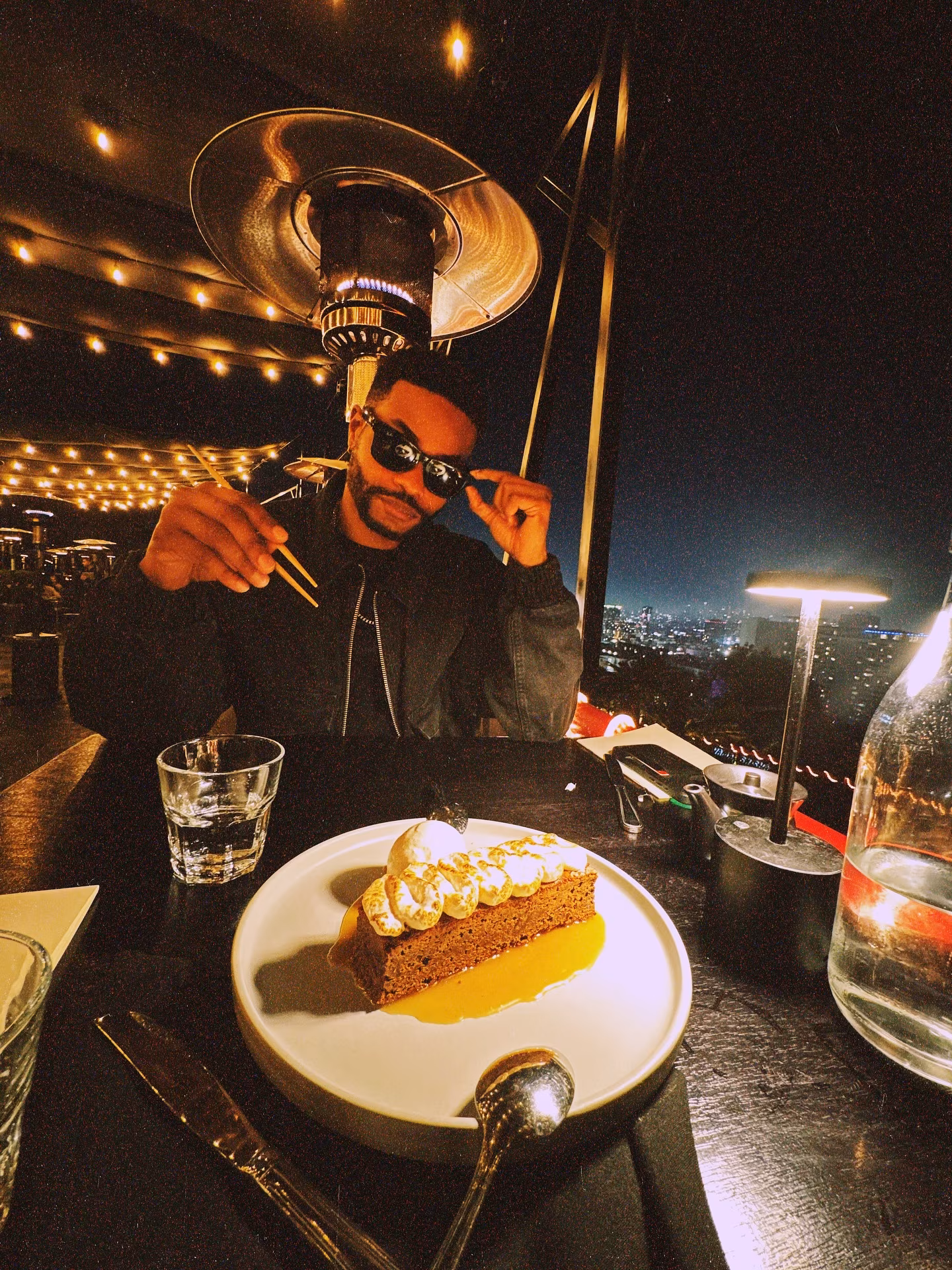 King Bach Celebrates With Cake Amid Busy Shoot